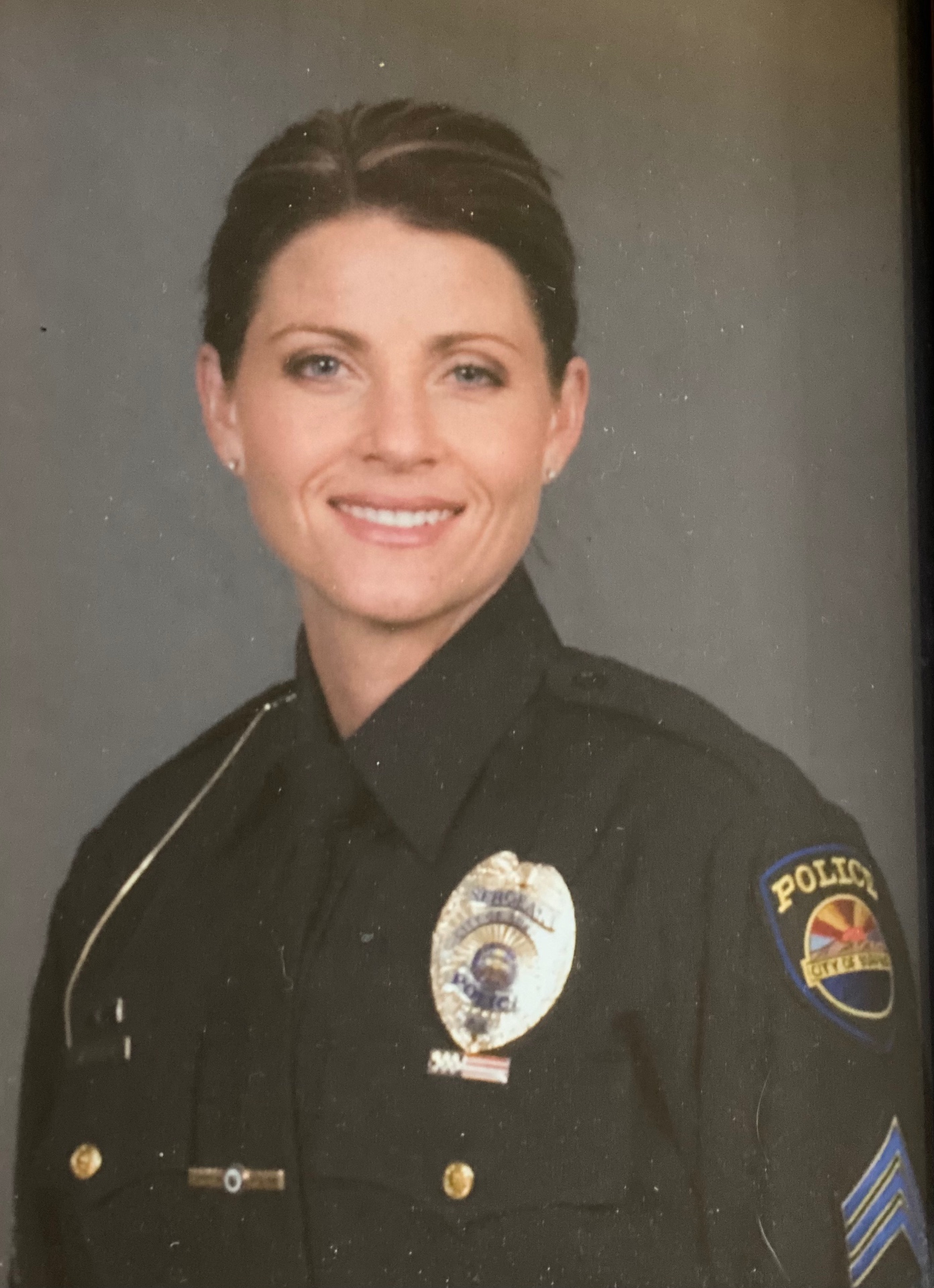 Marci in police uniform during her law enforcement career