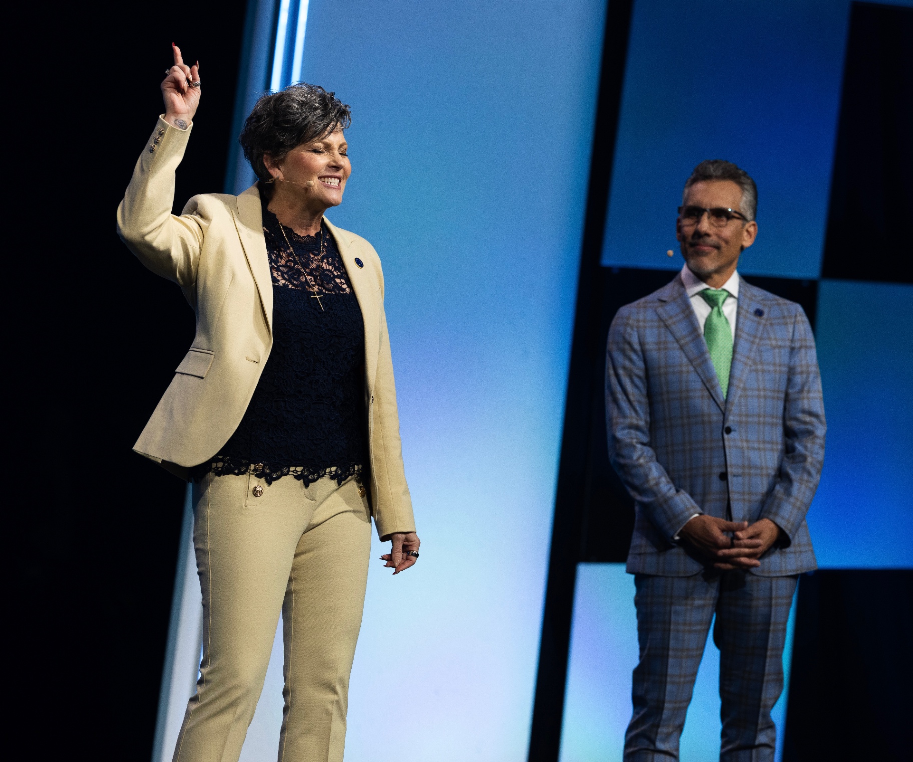 Marci and Dondee on stage at a LifeVantage event